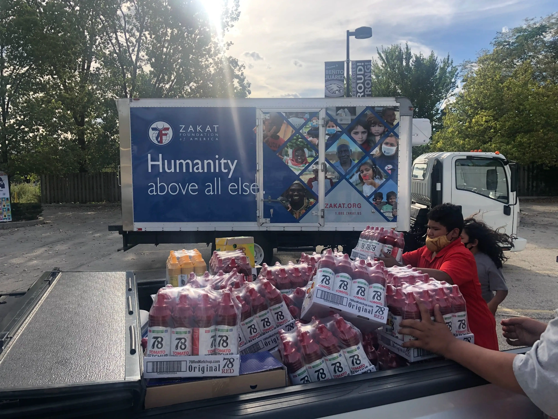78 Brand cases of ketchup being unloaded for a community food drive with the Zakat Foundation of America in Chicago