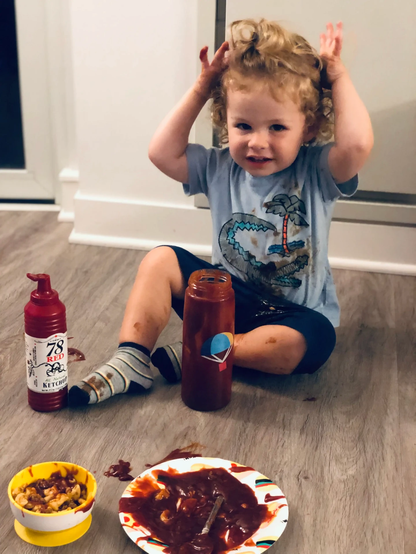 Toddler with 78 Red ketchup bottle