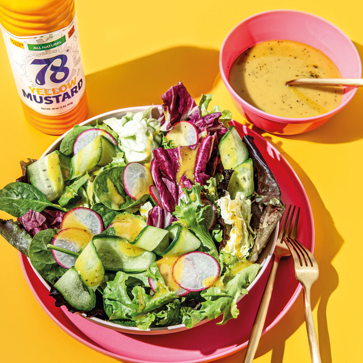 78 Yellow Mustard drizzled over a fresh garden salad