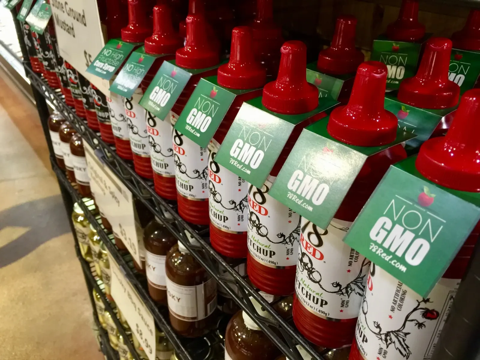 78 Brand Non-GMO ketchup bottles on a retail shelf